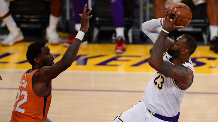 May 30, 2021; Los Angeles, California, USA; Los Angeles Lakers forward LeBron James (23) shoots against Phoenix Suns center Deandre Ayton (22) during the second half in game four of the first round of the 2021 NBA Playoffs. at Staples Center. Mandatory Credit: Gary A. Vasquez-Imagn Images May 30, 2021; Los Angeles, California, USA; Los Angeles Lakers forward LeBron James (23) shoots against Phoenix Suns center Deandre Ayton (22) during the second half in game four of the first round of the 2021 NBA Playoffs. at Staples Center. Mandatory Credit: Gary A. Vasquez-Imagn Images