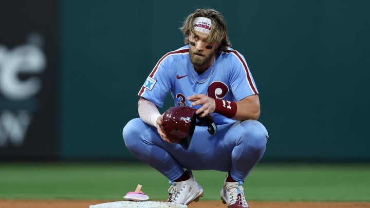 Aug 15, 2024; Philadelphia, Pennsylvania, USA; Philadelphia Phillies first base Bryce Harper (3) crouches on second base after his RBI single during the fourth inning against the Washington Nationals at Citizens Bank Park.