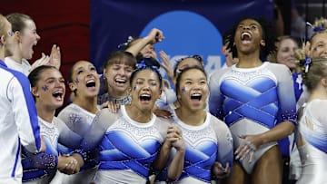 Apr 1, 2023; Norman, OK, USA; Kentucky celebrates after learning they will advance during the 2023 NCAA women's gymnastics regional championship at Lloyd Noble Center. Mandatory Credit: Alonzo Adams-Imagn Images