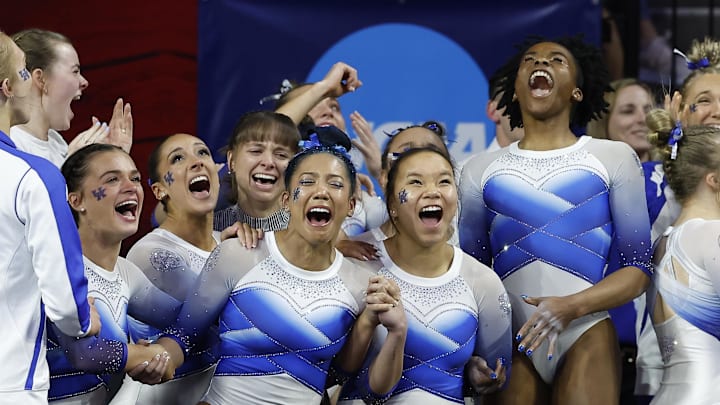 Apr 1, 2023; Norman, OK, USA; Kentucky celebrates after learning they will advance during the 2023 NCAA women's gymnastics regional championship at Lloyd Noble Center. Mandatory Credit: Alonzo Adams-Imagn Images