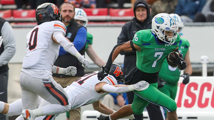 Green Bay Notre Dame's Kingston Allen (7) is forced out of bounds by West De Pere High School's Cooper Borowicz (21) during the WIAA Division 2 state championship football game on Friday, November 21, 2025, at Camp Randall Stadium in Madison, Wis. 
Tork Mason/USA TODAY NETWORK-Wisconsin