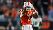 Sep 13, 2025; Miami Gardens, Florida, USA; Miami Hurricanes wide receiver CJ Daniels (7) reacts after making a catch against the South Florida Bulls during the second quarter at Hard Rock Stadium. Mandatory Credit: Sam Navarro-Imagn Images