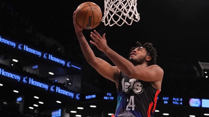 Apr 6, 2024; Brooklyn, New York, USA; Brooklyn Nets shooting guard Cam Thomas (24) shoots a layup against the Detroit Pistons during the second half at Barclays Center. Mandatory Credit: Gregory Fisher-USA TODAY Sports