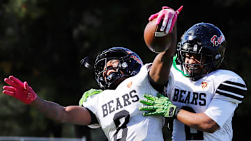 Clairton's Brandon Murphy, left, celebrates with Donte Wright after catching a  37-yard touchdown pass from Jeffrey Thompson Saturday at Riverside Park Oct. 12 in Oakmont. The Bears advance to the PIAA Class A final for the eighth time and will have their third matchup with District 6 champion Bishop Guilfoyle in the final.
