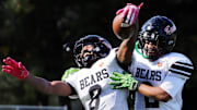 Clairton's Brandon Murphy, left, celebrates with Donte Wright after catching a  37-yard touchdown pass from Jeffrey Thompson Saturday at Riverside Park in Oakmont. Murphy scored twice and the Bears rolled to a 66-0 win.
