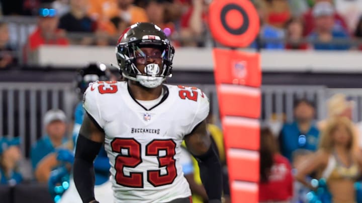 Jacksonville Jaguars wide receiver Parker Washington (11) scores a touchdown as Tampa Bay Buccaneers safety Tykee Smith (23) looks on during the second quarter of a preseason NFL football game Saturday, Aug. 17, 2024 at EverBank Stadium in Jacksonville, Fla. [Corey Perrine/Florida Times-Union]