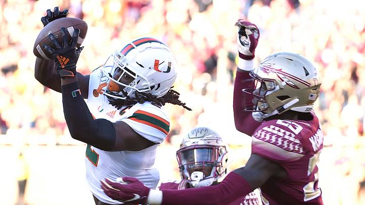 Nov 2, 2019; Tallahassee, FL, USA; Miami Hurricanes wide receiver KJ Osborn (2) catches a pass past Florida State Seminoles defensive back Hamsah Nasirildeen (23) at Doak Campbell Stadium. Mandatory Credit: Melina Myers-USA TODAY Sports