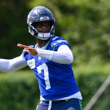 Jul 27, 2024; Renton, WA, USA; Seattle Seahawks quarterback Geno Smith throws during training camp at Virginia Mason Athletic Center. Mandatory Credit: Steven Bisig-USA TODAY Sports