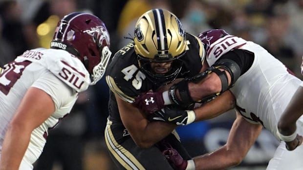 Purdue Boilermakers running back Devin Mockobee (45) is tackled 