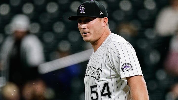 Apr 9, 2025; Denver, Colorado, USA; Colorado Rockies relief pitcher Seth Halvorsen (54) reacts after making a throwing error in the ninth inning against the Milwaukee Brewers at Coors Field Apr 9, 2025; Denver, Colorado, USA; Colorado Rockies relief pitcher Seth Halvorsen (54) reacts after making a throwing error in the ninth inning against the Milwaukee Brewers at Coors Field
