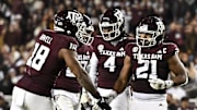 Nov 30, 2024; College Station, Texas, USA; Texas A&M Aggies linebacker Taurean York (21) reacts against the Texas Longhorns during the second half. The Longhorns defeated the Aggies 17-7 at Kyle Field. Mandatory Credit: Maria Lysaker-Imagn Images  