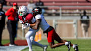 Nov 16, 2024; Stanford, California, USA; Stanford Cardinal wide receiver Emmett Mosley V (10) is tackled out of bounds during the first quarter against the Louisville Cardinals at Stanford Stadium. Mandatory Credit: Bob Kupbens-Imagn Images