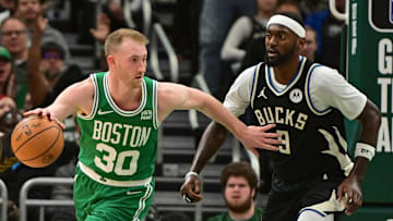 Apr 9, 2024; Milwaukee, Wisconsin, USA; Boston Celtics forward Sam Hauser (30) drives past Milwaukee Bucks forward Bobby Portis (9) in the fourth quarter at Fiserv Forum. Mandatory Credit: Benny Sieu-Imagn Images