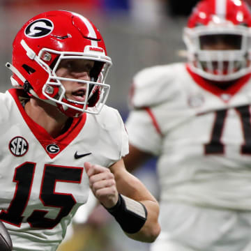 Georgia quarterback Carson Beck (15) runs the ball during the first half of the SEC Championship game against Alabama at Mercedes-Benz Stadium in Atlanta, on Saturday, Dec. 2, 2023.