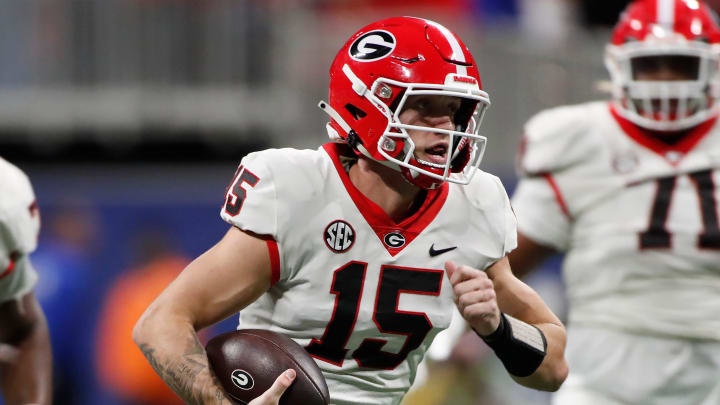 Georgia quarterback Carson Beck (15) runs the ball during the first half of the SEC Championship game against Alabama at Mercedes-Benz Stadium in Atlanta, on Saturday, Dec. 2, 2023.