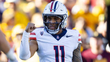 Nov 25, 2023; Tempe, Arizona, USA; Arizona Wildcats quarterback Noah Fifita (11) celebrates a touchdown against the Arizona State Sun Devils in the first half of the Territorial Cup at Mountain America Stadium.