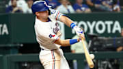 Texas Rangers third baseman Josh Jung (6) hits an rbi single against the Los Angeles Angels during the first inning at Globe Life Field. 