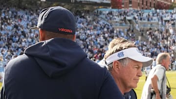 Oct 25, 2025; Chapel Hill, North Carolina, USA; North Carolina Tar Heels head coach Bill Belichick shakes Virginia Cavaliers head coach Tony Elliott hand after the Tar Heels lose to Virginia in overtime at Kenan Stadium. Mandatory Credit: Bob Donnan-Imagn Images