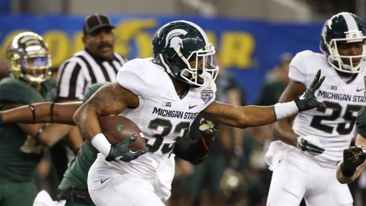 Jan 1, 2015; Arlington, TX, USA; Michigan State Spartans running back Jeremy Langford (33) runs during the first half against the Baylor Bears n the 2015 Cotton Bowl Classic at AT&T Stadium. Mandatory Credit: Kevin Jairaj-USA TODAY Sports