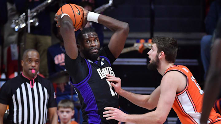 Jan 29, 2026; Champaign, Illinois, USA;  Washington Huskies center Franck Kepnang (11) is guarded by Illinois Fighting Illini center Tomislav Ivisic (13) during the first half at State Farm Center. Mandatory Credit: Ron Johnson-Imagn Images