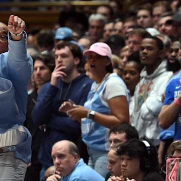 UNC basketball head coach Hubert Davis versus Duke