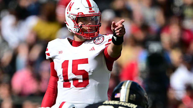  Nebraska Cornhuskers quarterback Dylan Raiola (15) points at the line of scrimmage before the snap against the Purdue Boiler
