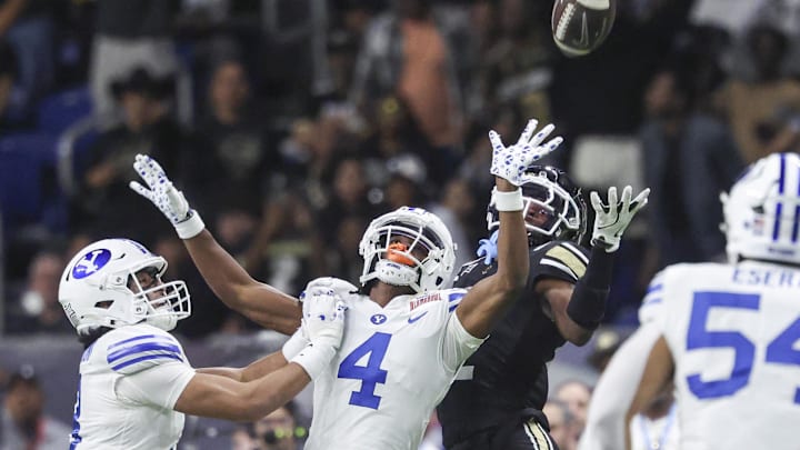 Dec 28, 2024; San Antonio, TX, USA; Brigham Young Cougars cornerback Mory Bamba (4) defends against a pass intended for Colorado Buffaloes wide receiver Travis Hunter (12) during the fourth quarter at Alamodome. Mandatory Credit: Troy Taormina-Imagn Images