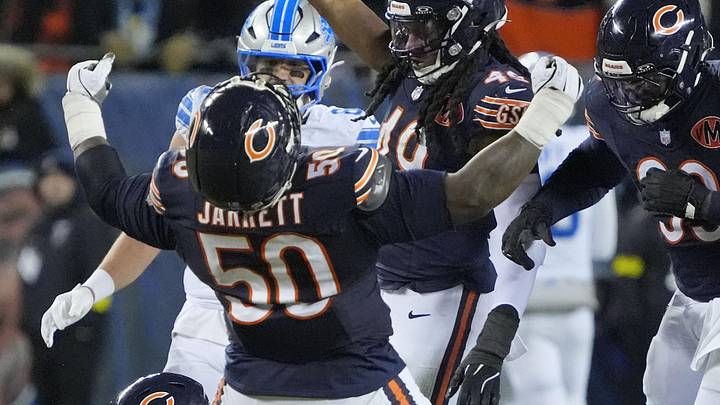 Jan 4, 2026; Chicago, Illinois, USA; Chicago Bears defensive end Grady Jarrett (50) and linebacker Tremaine Edmunds (49) celebrate after a play against the Detroit Lions during the second half at Soldier Field. Mandatory Credit: David Banks-Imagn Images