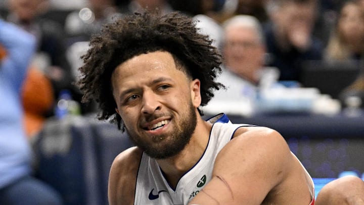 Detroit Pistons guard Cade Cunningham (2) reacts to being knocked to the floor during the second half against the Dallas Mavericks at the American Airlines Center on Mar 21, 2025.