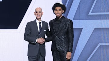 Jun 25, 2025; Brooklyn, NY, USA; Dylan Harper stands with NBA commissioner Adam Silver after being selected as the second pick by the San Antonio Spurs in the first round of the 2025 NBA Draft at Barclays Center.