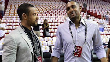 Former players Trajan Langdon (left) and Grant Hill (right) talk prior to game four of the 2014 NBA Finals between the Miami Heat and the San Antonio Spurs at American Airlines Arena.