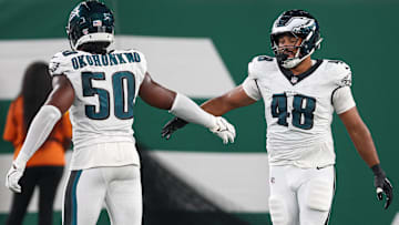 Aug 22, 2025; East Rutherford, New Jersey, USA; Philadelphia Eagles linebacker Patrick Johnson (48) celebrates a sack with defensive end Ogbo Okoronkwo (50) during the first half against the New York Jets at MetLife Stadium.