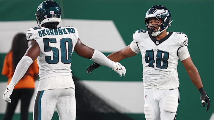 Aug 22, 2025; East Rutherford, New Jersey, USA; Philadelphia Eagles linebacker Patrick Johnson (48) celebrates a sack with defensive end Ogbo Okoronkwo (50) during the first half against the New York Jets at MetLife Stadium.
