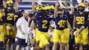 Aug 31, 2024; Ann Arbor, Michigan, USA;  Michigan Wolverines defensive back Will Johnson (2) runs the ball after he makes an interception in the second half against the Fresno State Bulldogs at Michigan Stadium. Mandatory Credit: Rick Osentoski-Imagn Images