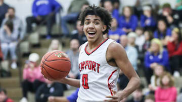 Newport's Taylen Kinney (0) reacts after scoring two of his 13 points in the first half against Washington County at Wednesday's 2023 King of the Bluegrass basketball tournament at Fairdale High School. Dec. 20, 2023