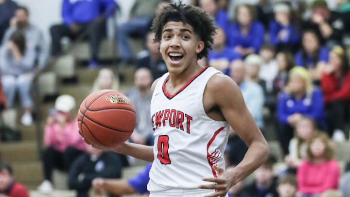 Newport's Taylen Kinney (0) reacts after scoring two of his 13 points in the first half against Washington County at Wednesday's 2023 King of the Bluegrass basketball tournament at Fairdale High School. Dec. 20, 2023