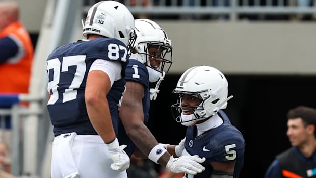 Penn State Nittany Lions receiver Devonte Ross celebrates with teammates Kyron Hudson and Andrew Rappleyea.
