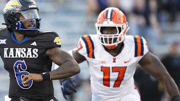 Sep 8, 2023; Lawrence, Kansas, USA; Kansas Jayhawks quarterback Jalon Daniels (6) throws a pass against Illinois Fighting Illini linebacker Gabe Jacas (17) during the first half at David Booth Kansas Memorial Stadium. Mandatory Credit: Jay Biggerstaff-Imagn Images