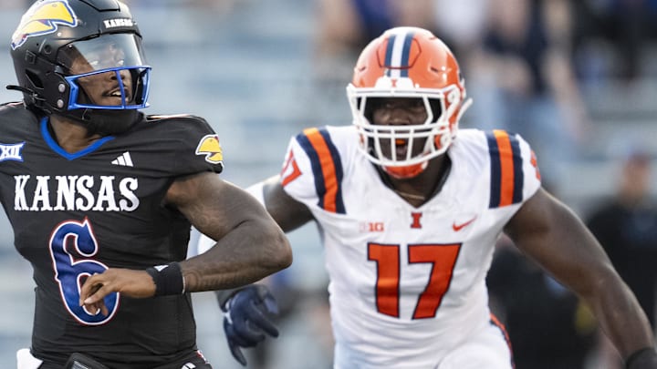 Sep 8, 2023; Lawrence, Kansas, USA; Kansas Jayhawks quarterback Jalon Daniels (6) throws a pass against Illinois Fighting Illini linebacker Gabe Jacas (17) during the first half at David Booth Kansas Memorial Stadium. Mandatory Credit: Jay Biggerstaff-Imagn Images