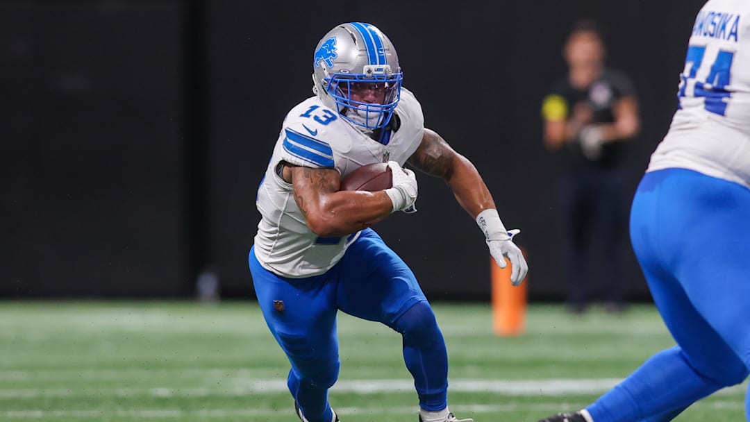 Aug 8, 2025; Atlanta, Georgia, USA; Detroit Lions running back Craig Reynolds (13) runs the ball against the Atlanta Falcons in the second quarter at Mercedes-Benz Stadium. Mandatory Credit: Brett Davis-Imagn Images