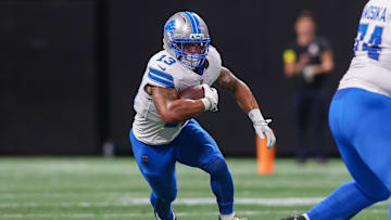 Aug 8, 2025; Atlanta, Georgia, USA; Detroit Lions running back Craig Reynolds (13) runs the ball against the Atlanta Falcons in the second quarter at Mercedes-Benz Stadium. Mandatory Credit: Brett Davis-Imagn Images