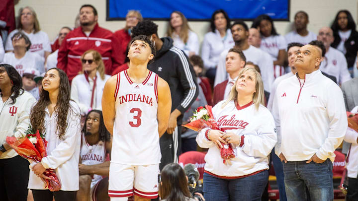 Indiana's Anthony Leal (3) watches a video presentation with his family during Senior Day festivities after the Indiana versus Ohio State men's basketball game at Simon Skjodt Assembly Hall on Saturday, March 8, 2025.