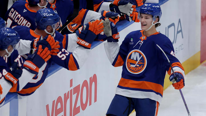Oct 11, 2025; Elmont, New York, USA; New York Islanders defenseman Matthew Schaefer (48) celebrates his goal against the Washington Capitals with teammates during the third period at UBS Arena. The goal was the first of his NHL career. Mandatory Credit: Brad Penner-Imagn Images