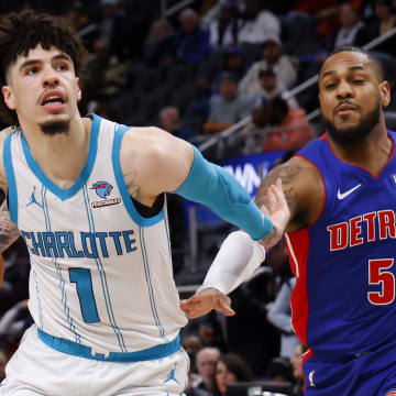 Jan 24, 2024; Detroit, Michigan, USA;  Charlotte Hornets guard LaMelo Ball (1) dribbles on Detroit Pistons guard Monte Morris (5) in the second half at Little Caesars Arena. Mandatory Credit: Rick Osentoski-USA TODAY Sports
