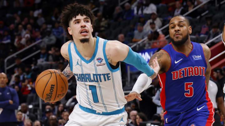 Jan 24, 2024; Detroit, Michigan, USA;  Charlotte Hornets guard LaMelo Ball (1) dribbles on Detroit Pistons guard Monte Morris (5) in the second half at Little Caesars Arena. Mandatory Credit: Rick Osentoski-USA TODAY Sports