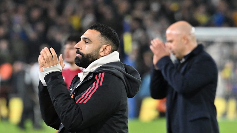 Mohamed Salah (left) with Arne Slot in the background.