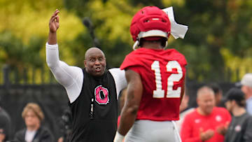 Ohio State Buckeyes running backs coach Carlos Locklyn works with running back CJ Donaldson (12) during the first football practice of the season at the Woody Hayes Athletic Center on July 31, 2025.