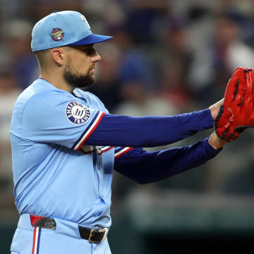 Jul 7, 2024; Arlington, Texas, USA;  Texas Rangers pitcher Nathan Eovaldi (17) starts his wide up in the first inning against the Tampa Bay Rays at Globe Life Field. Mandatory Credit: Tim Heitman-USA TODAY Sports