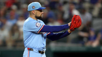 Jul 7, 2024; Arlington, Texas, USA;  Texas Rangers pitcher Nathan Eovaldi (17) starts his wide up in the first inning against the Tampa Bay Rays at Globe Life Field. 