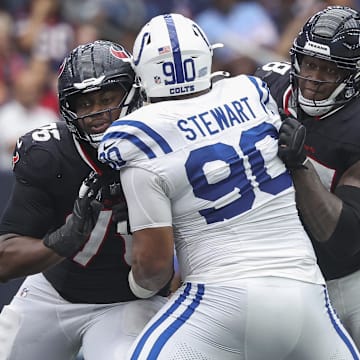 Houston Texans guard Kenyon Green (76) and offensive tackle Laremy Tunsil (78) attempt to block